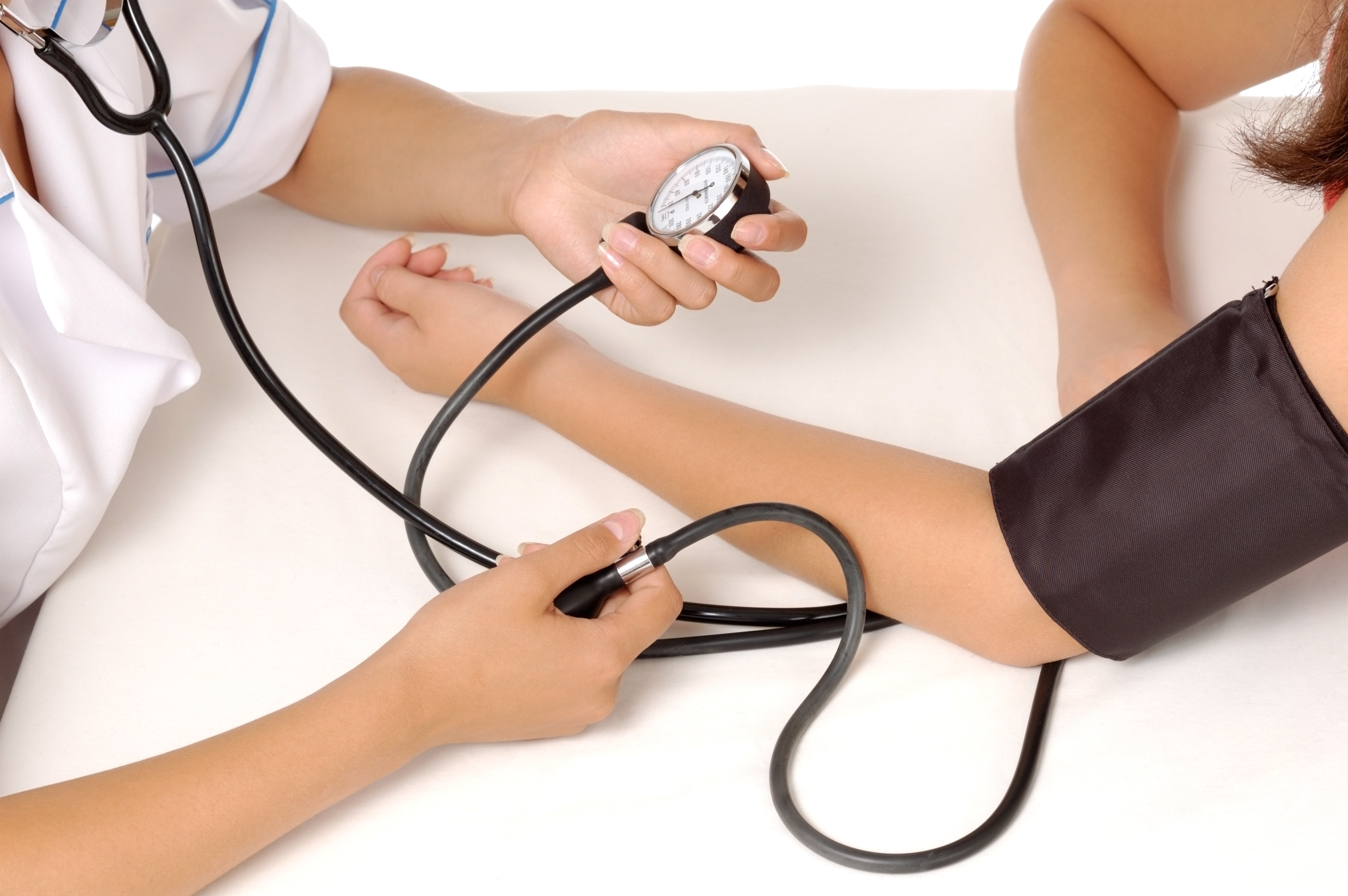 Patient is being observed by doctor - measuring blood pressure